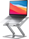 Portable adjustable laptop stand holding a laptop on a desk