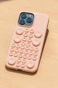 Silicone Pop It iPhone case by Tekvynstore with colorful pop-it bubble design for iPhone protection and fun.