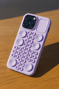 Tekvynstore silicone Pop It iPhone case with colorful bubble pop design for iPhone protection and fun.